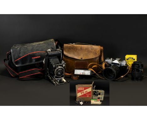 Zenit Em 35mm Camera Together with two lenses and accessories in camera bag. Also, a Houghton Butcher Co. ltd Ensign 1930's m