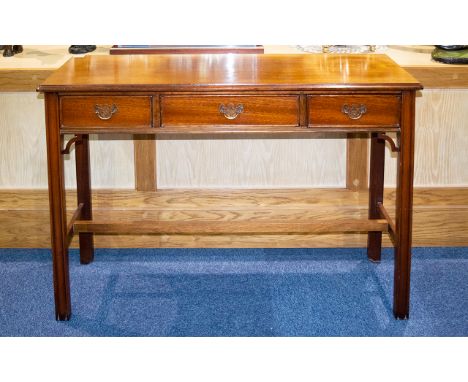 Early - Mid 20th Century Console/Hall Table Of rectangular form with three central drawers, brass pull handles and bottom str