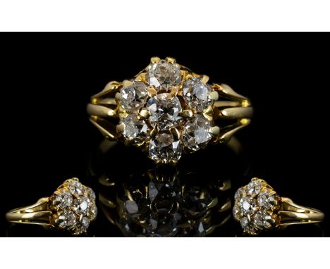 Antique 18ct Gold And Diamond Cluster Ring Set with seven old round cut diamonds in a flowerhead setting. White, bright VS st