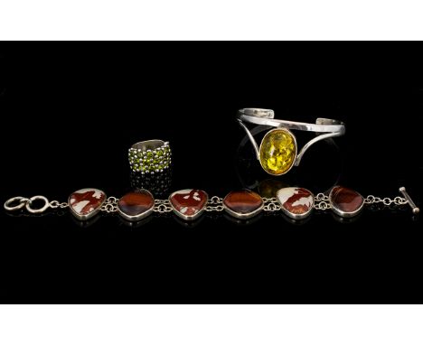 Three Pieces Of Silver And Mixed Metal Jewellery To include gem set ring, stamped 925, amber set bangle - unmarked, also a ha