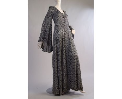 A Rare Early 1970's Vintage Biba dress.  This fabulous black and silver metallic  dress is a classical, romantic, whimsical d