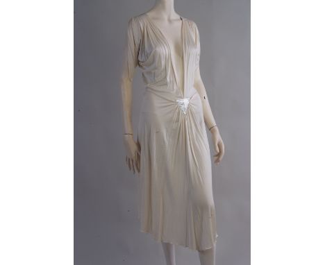 A 1970's 'Christian Dior' silk jersey Dress.  A soft silk jersey dress with a plunged neckline to the waist.  A metallic silv