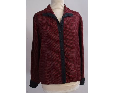 A Hermes Paris silk blouse. Soft light silk, with buttons down the front and at the cuffs. Size 44. (1)