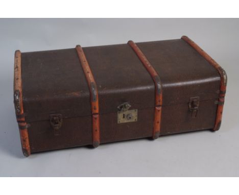 A trunk. 36" x 21"  With wooden bands and metal corner guards. leather handles at both ends. 