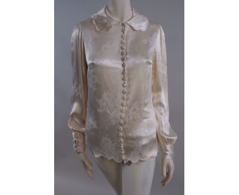 A 1930's Satin damask Blouse.  This beautiful blouse has a fabulous vintage weight to the fabric. The long sleeves fall grace