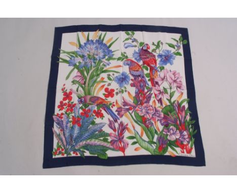 A Christian Dior silk Parrot scarf.  With flowers and maccaws in bright vibrant colours, printed onto a wonderful soft silk g