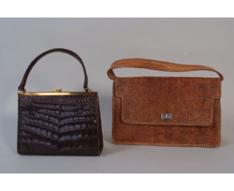 Two 1950's Vintage Crocodile Handbags. To include a dark crocodile handbag with a single handle and brass clasp, a Suede insi