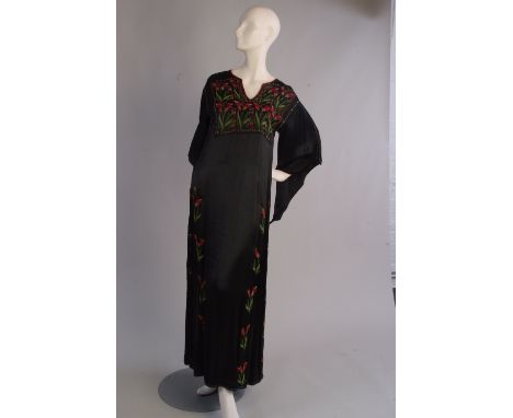 A 1930's Embroidered Kaftan Dress.  Luxurious black satin with embroidered front yolk, enpire line.  Flowers embroidered down