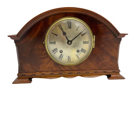 A mahogany cased 1950s spring driven mantle clock, striking the hours and half hours on a coiled gong, with an English ”Empir