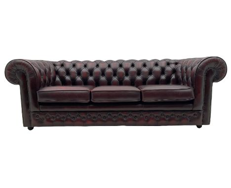 Chesterfield three seat sofa, upholstered in deeply buttoned oxblood leatherDimensions: Height:&nbsp;73cm&nbsp; Length/Width: