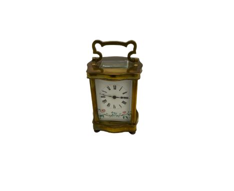 A French dauphine cased carriage clock c1890, four bevelled glass panels and a rectangular glass to the top, with a white ena