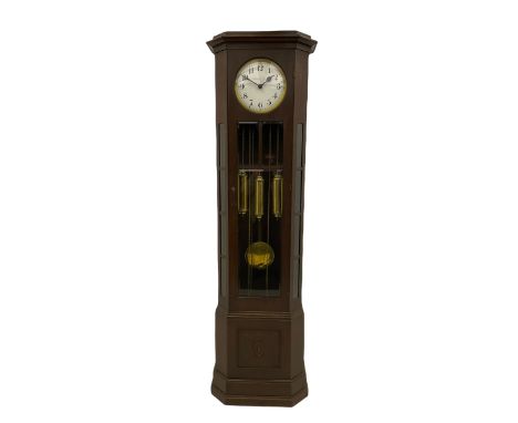 A mid-20th century weight driven floor standing clock in an oak case with canted glazed panels, full length glazed trunk door