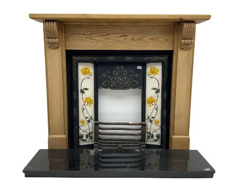 Complete fireplace - pine surround with ornate cast iron inset with Art Nouveau style floral tiles, granite hearth, brass fen
