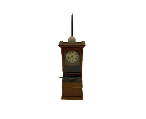 An early 20th century time recording clock (clocking in machine) manufactured by the International Time Recording Company, in