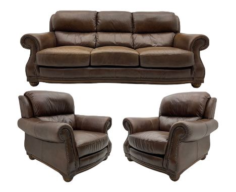 Three seat sofa (W234cm, D100cm), and pair of matching armchairs (W113cm, D100cm), upholstered in brown leatherDimensions: He