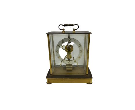 A mid-20th century German Kieninger & Obergfell, “Kundo” battery operated mantle clock, rectangular case with four bevelled v