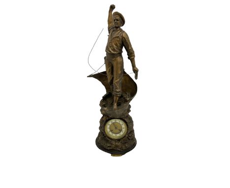 An imposing bronzed spelter clock depicting a 19th century fisherman, on a circular ebonised base with a plaque entitled “Cod