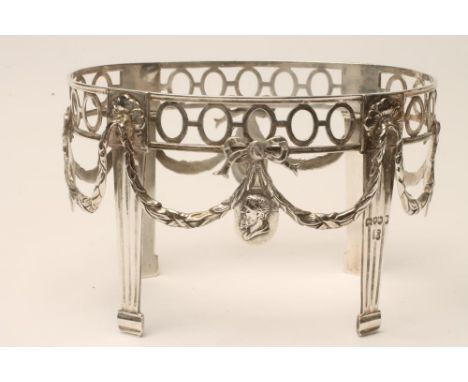 A VICTORIAN SILVER DISH STAND, makers Dobson & Dobson, London 1885, of oval form, the spectacle pierced rim supported on four