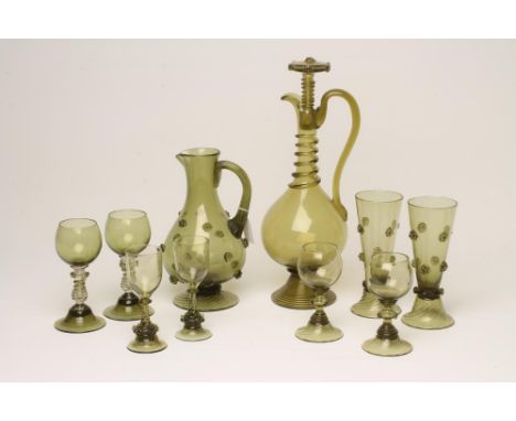 A GERMAN PART TABLE SUITE, late 19th century, in olive green, with applied raspberry prunts comprising baluster jug, 9 1/2" h