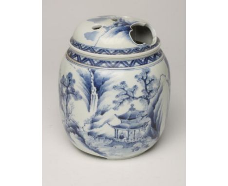 A JAPANESE PORCELAIN JAR AND COVER of cylindrical form raised upon three bracket feet, the cover pierced with a large lobed p