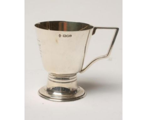 AN ART DECO SILVER MUG, makers Burns, Oats & Washbourne Ltd., London 1946, the rounded conical bowl engraved with a presentat