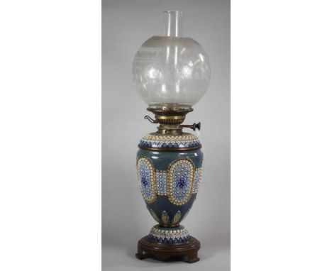A LATE VICTORIAN DOULTON STONEWARE OIL LAMP BASE, of ovoid form with lift-out metal lined reservoir, tubelined and moulded in