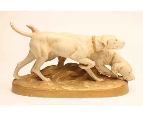 A ROYAL DUX BISQUE PORCELAIN MODEL OF A POINTER AND RETRIEVER, early 20th century, on a naturalistically moulded oval base, p