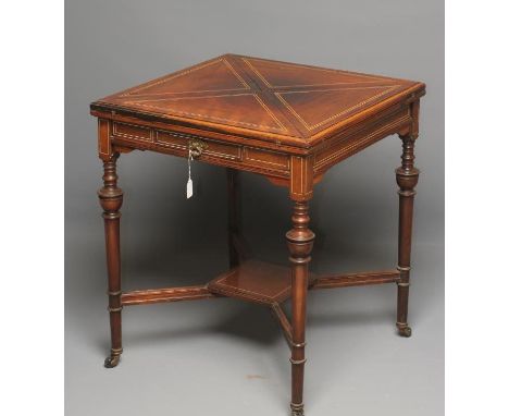 A LATE VICTORIAN ROSEWOOD ENVELOPE CARD TABLE of usual form with stringing, green baize lined top with counter wells, recesse