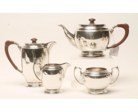 A THREE PIECE SILVER TEA SERVICE, maker Frank Cobb, Sheffield 1958, of plain rounded cylindrical form on a low stepped foot, 