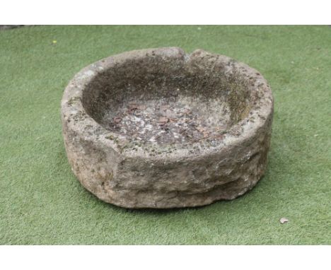 A SANDSTONE TROUGH of deep circular form, 26 1/2" x 9 1/2" (Est. plus 18% premium inc. VAT)