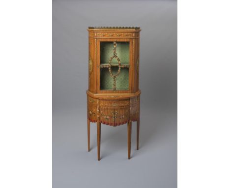 AN EDWARDIAN SATINWOOD TWO STAGE DISPLAY CABINET of demi lune form painted with floral festoons and ribbon tied portrait pate