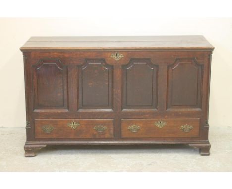 A GEORGIAN OAK PANELLED CHEST,  mid/late 18th century, the now split hinged plank lid opening to interior with till box over 