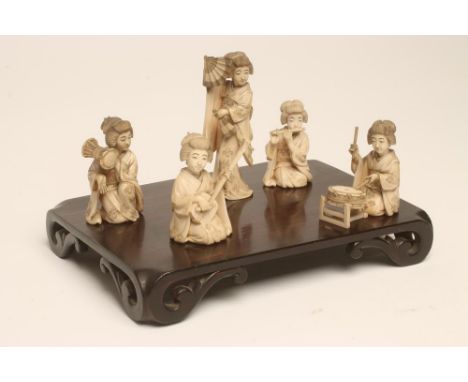A COLLECTION OF JAPANESE IVORY FEMALE MUSICIANS AND FAN DANCER, Meiji period, the kneeling figures playing a flute, drum, oka