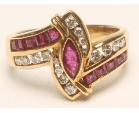 A RUBY AND DIAMOND DRESS RING, centred by an open back collet set marquise cut ruby in a crossover style setting with channel