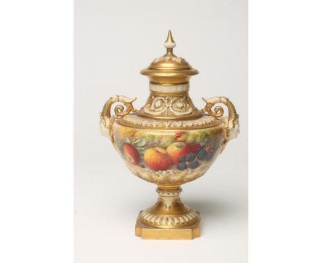 A ROYAL WORCESTER CHINA PEDESTAL VASE AND COVER, 1925, with swag moulded waisted neck, two mask handles on a single knopped s