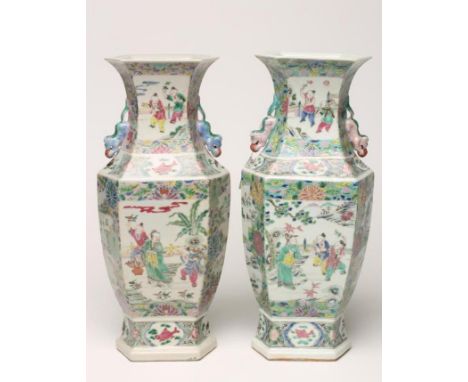 A PAIR OF CHINESE PORCELAIN VASES of inverted baluster hexagonal form with chi-long handles painted in polychrome enamels wit