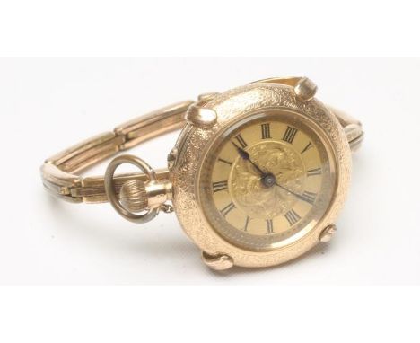 A LADY'S 14K GOLD TOP WIND FOB WATCH, the foliate engraved gilt dial with black painted Roman numerals to the engine turned c