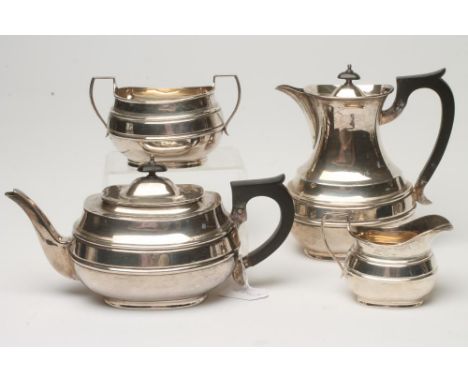 A SILVER FOUR PIECE TEA AND COFFEE SERVICE, makers probably Searle, Hoare & Co., Sheffield 1932, of single girdled rounded ob