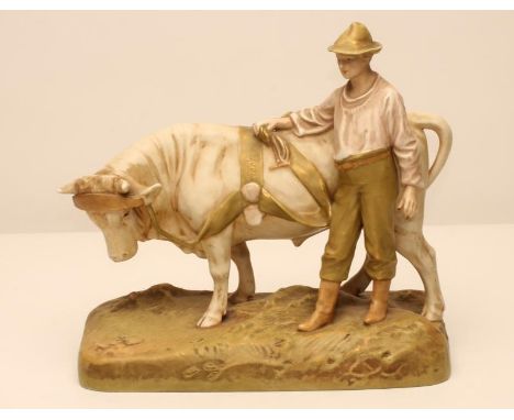 A ROYAL DUX BISQUE PORCELAIN FIGURE, early 20th century, as a young man wearing a hat, pink shirt and green breeches standing
