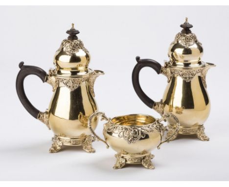 AN IRISH SILVER GILT THREE PIECE CHOCOLATE SET, makers Elkington & Co., Dublin 1913, of baluster form, with cast and applied 