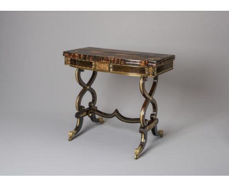 A REGENCY COROMANDEL AND BRASS INLAID CARD TABLE, of mildly bowed form with gilt metal mounts, folding swivel top with green 