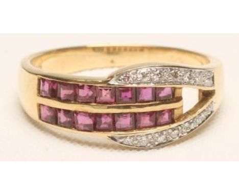 A RUBY AND DIAMOND RING, the two parallel bands channel set with square cut rubies within an open shoulder millegrain set wit