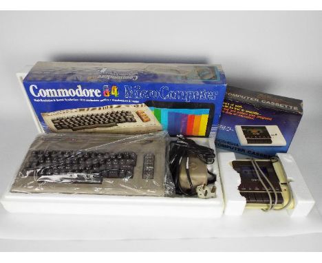 Commodore - Doshisha - A boxed vintage Commodore 64 computer with power transformer and coaxial lead. Also a boxed Doshisha C