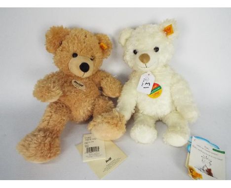 Steiff - two teddy bears - lot includes two Steiff bears. One teddy bear is cream-coloured and has a yellow tag on its ear. T