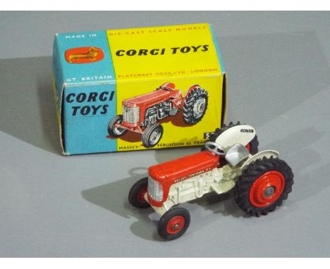 Corgi Toys - A boxed Corgi Toys #50 Massey Ferguson 65 Tractor. The model with red bonnet and hubs, cream / off white engine 