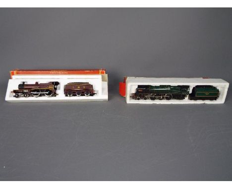 Hornby - 2 x boxed steam locos, a 4-6-2 class 7 Britannia in BR dark green operating number 70000 # R063. A 4-4-0 class 4P co