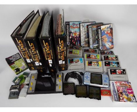 Nintendo - Sega - A collection of 10 x Super Nintendo games cartridges, 4 Sega Saturn games, an unbranded hand held console w