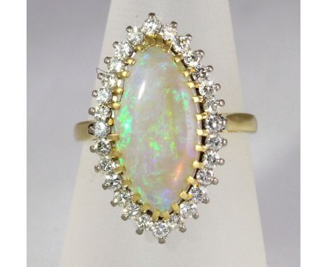 An 18ct H/M marquise shaped Opal and Diamond cluster ring, approx total diamond weight 0.80ct, size P

CONDITION REPORT - Mod