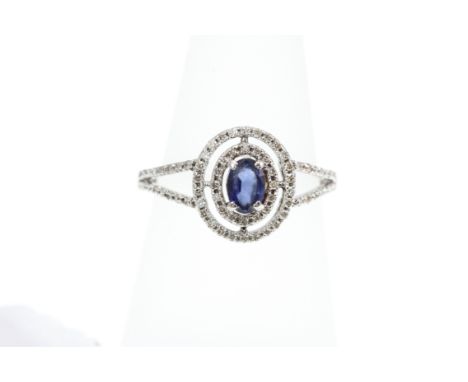 An 18ct H/M sapphire and diamond cluster ring, size Q  [VAT included in hammer price on this lot - this does not affect non-V