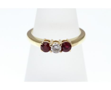 A three-stone Ruby and Diamond ring, stamped 18k, approx 5.5g, size R   [VAT included in hammer price on this lot - this does